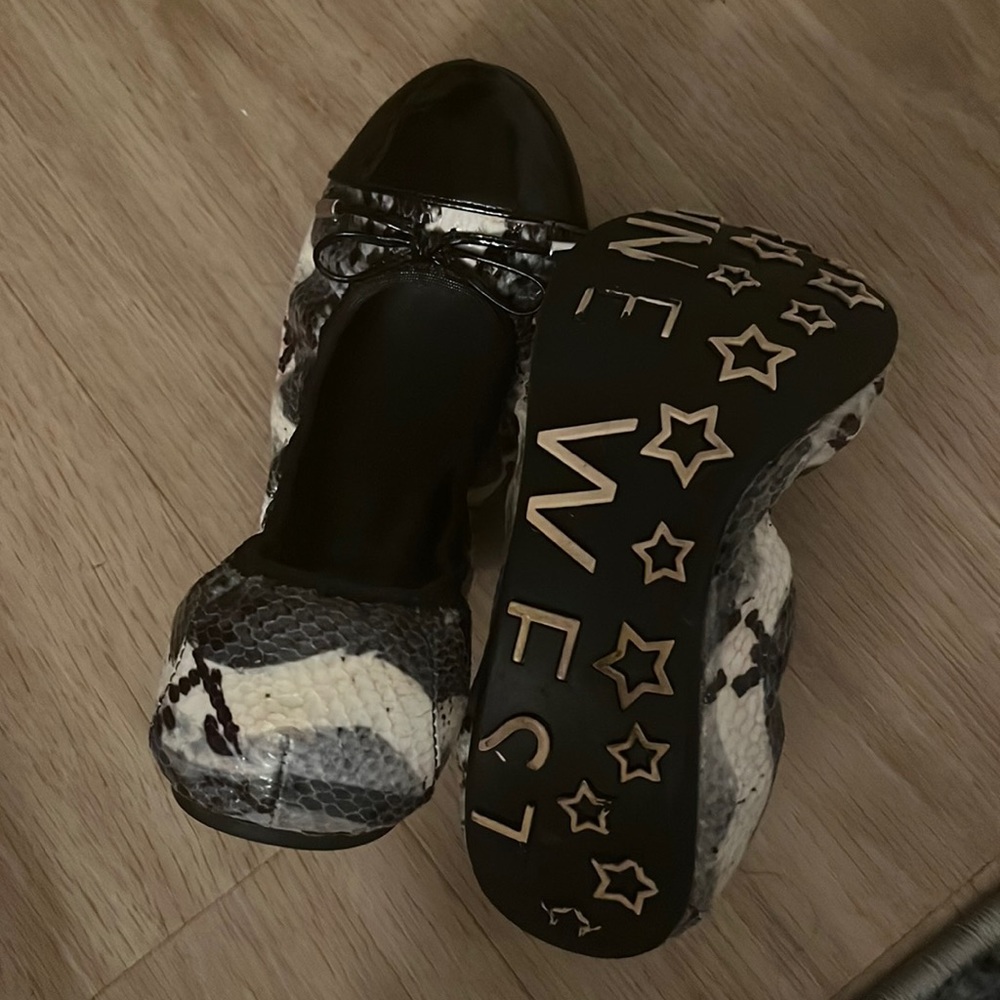 Black and white snakeskin flats
